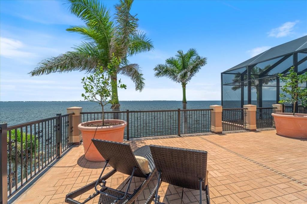 266 Bangsberg Road Southeast Port Charlotte, FL 33952 - Photo 26 of 100 a view of a chairs and table in patio