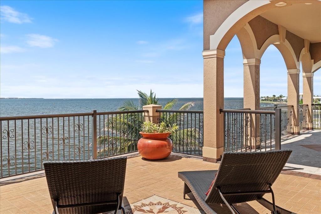 266 Bangsberg Road Southeast Port Charlotte, FL 33952 - Photo 30 of 100 a view of roof deck with two chairs and a potted plant