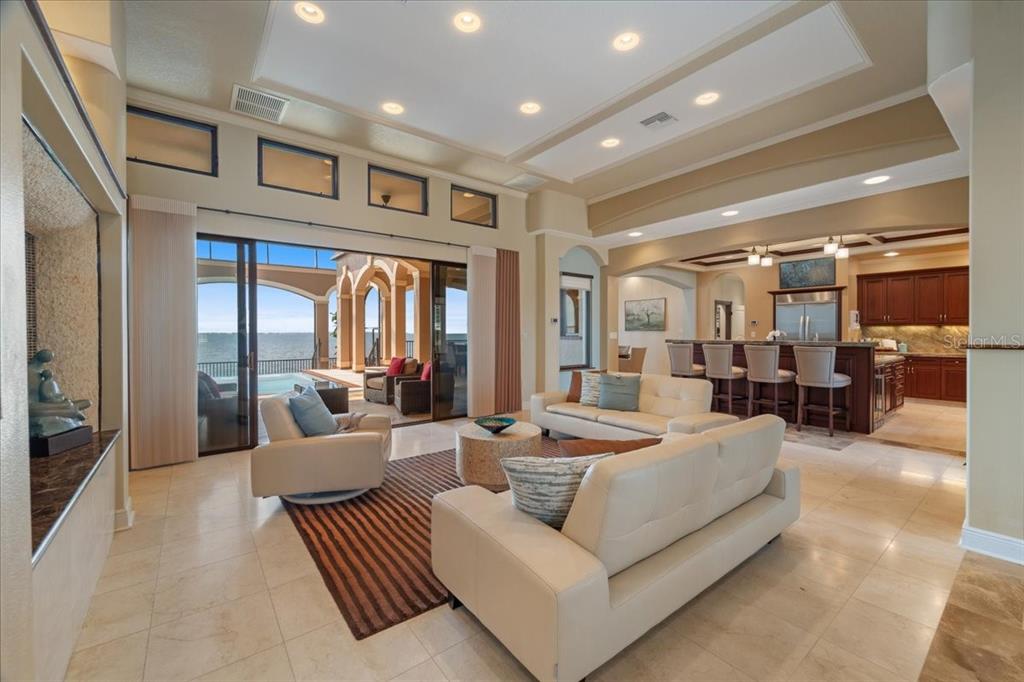 266 Bangsberg Road Southeast Port Charlotte, FL 33952 - Photo 32 of 100 a living room with furniture and a large window