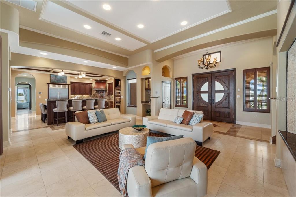 266 Bangsberg Road Southeast Port Charlotte, FL 33952 - Photo 34 of 100 a living room with furniture and a large window