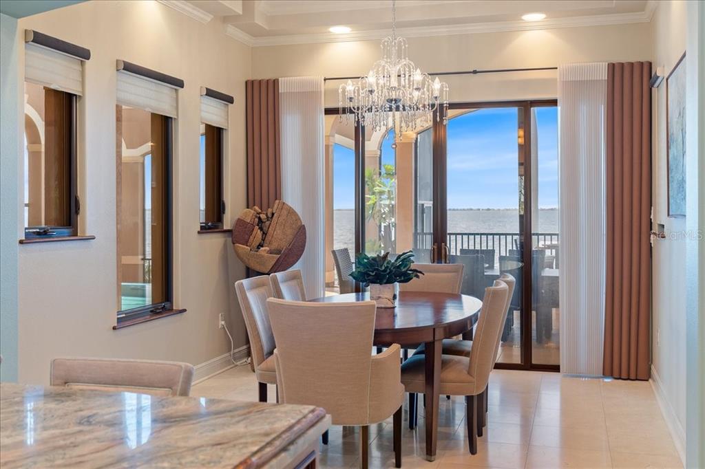 266 Bangsberg Road Southeast Port Charlotte, FL 33952 - Photo 39 of 100 a view of a dining room with furniture and chandelier