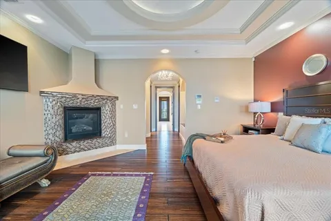 a room with pool table and windows