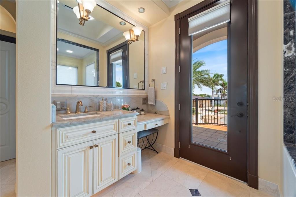 266 Bangsberg Road Southeast Port Charlotte, FL 33952 - Photo 50 of 100 a bathroom with a sink and a mirror
