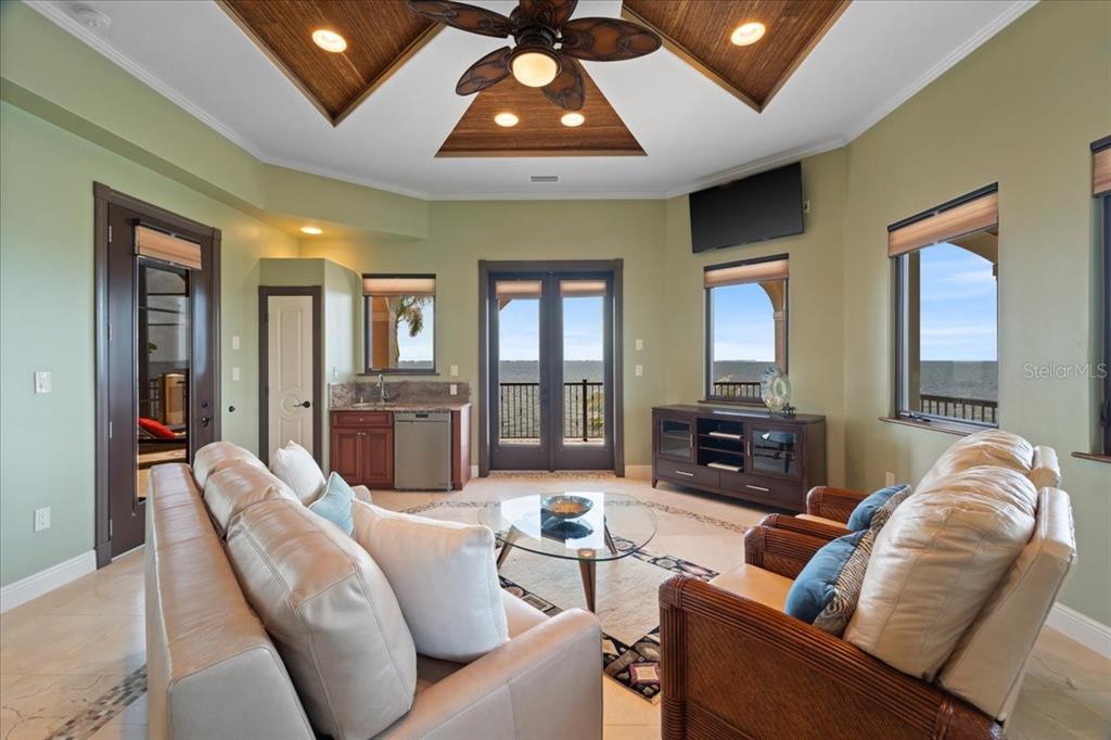 266 Bangsberg Road Southeast Port Charlotte, FL 33952 - Photo 67 of 100 a living room with furniture and wooden floor