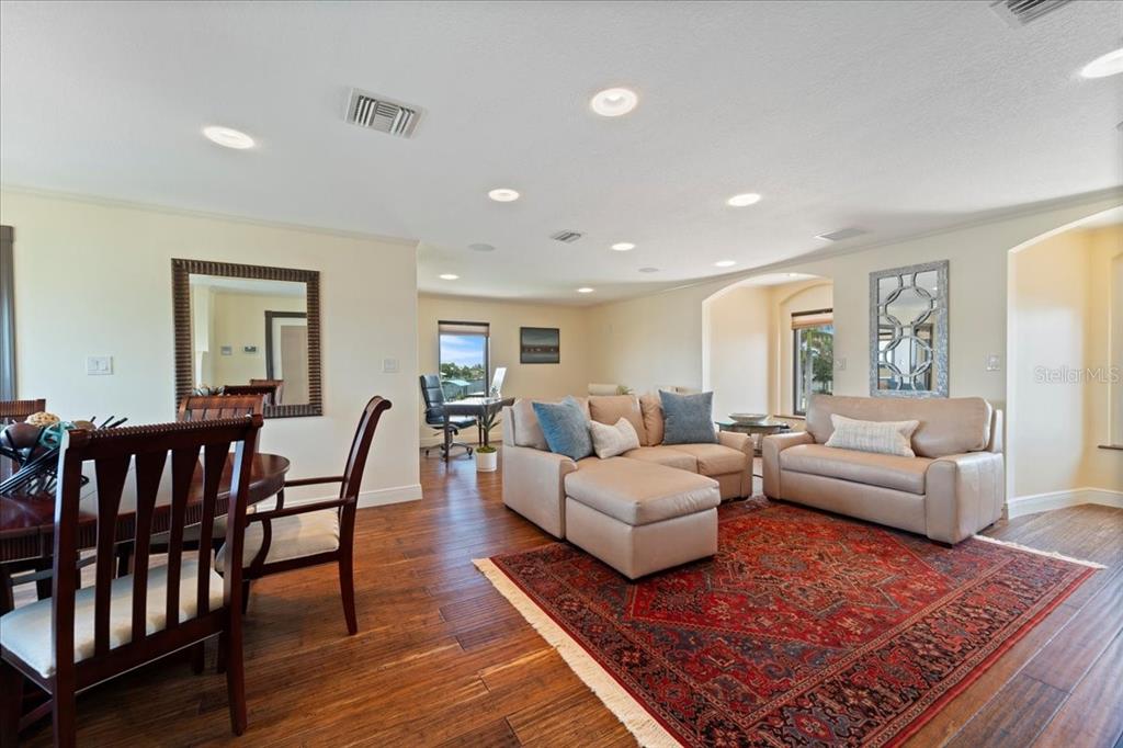 266 Bangsberg Road Southeast Port Charlotte, FL 33952 - Photo 74 of 100 a living room with furniture a rug and a window