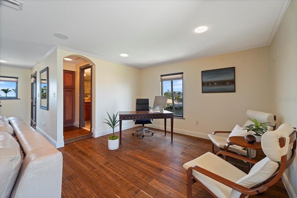 266 Bangsberg Road Southeast Port Charlotte, FL 33952 - Photo 76 of 100 a living room with furniture and a wooden floor