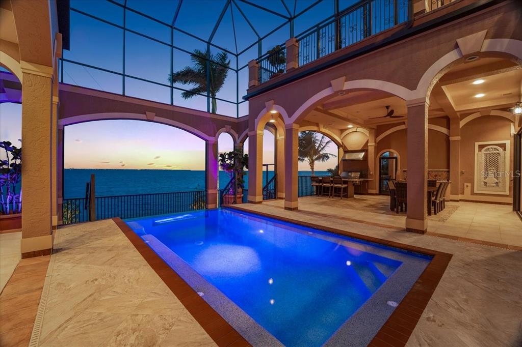 266 Bangsberg Road Southeast Port Charlotte, FL 33952 - Photo 94 of 100 a view of swimming pool with a table and chairs