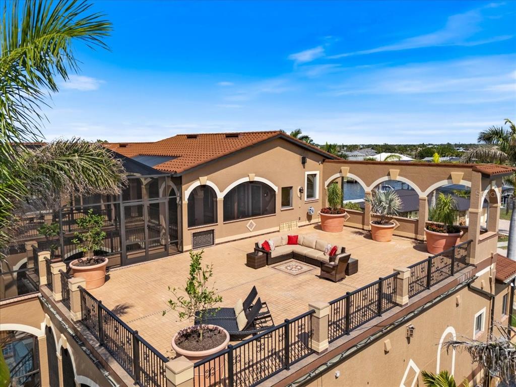 266 Bangsberg Road Southeast Port Charlotte, FL 33952 - Photo 98 of 100 a view of a swimming pool with a patio