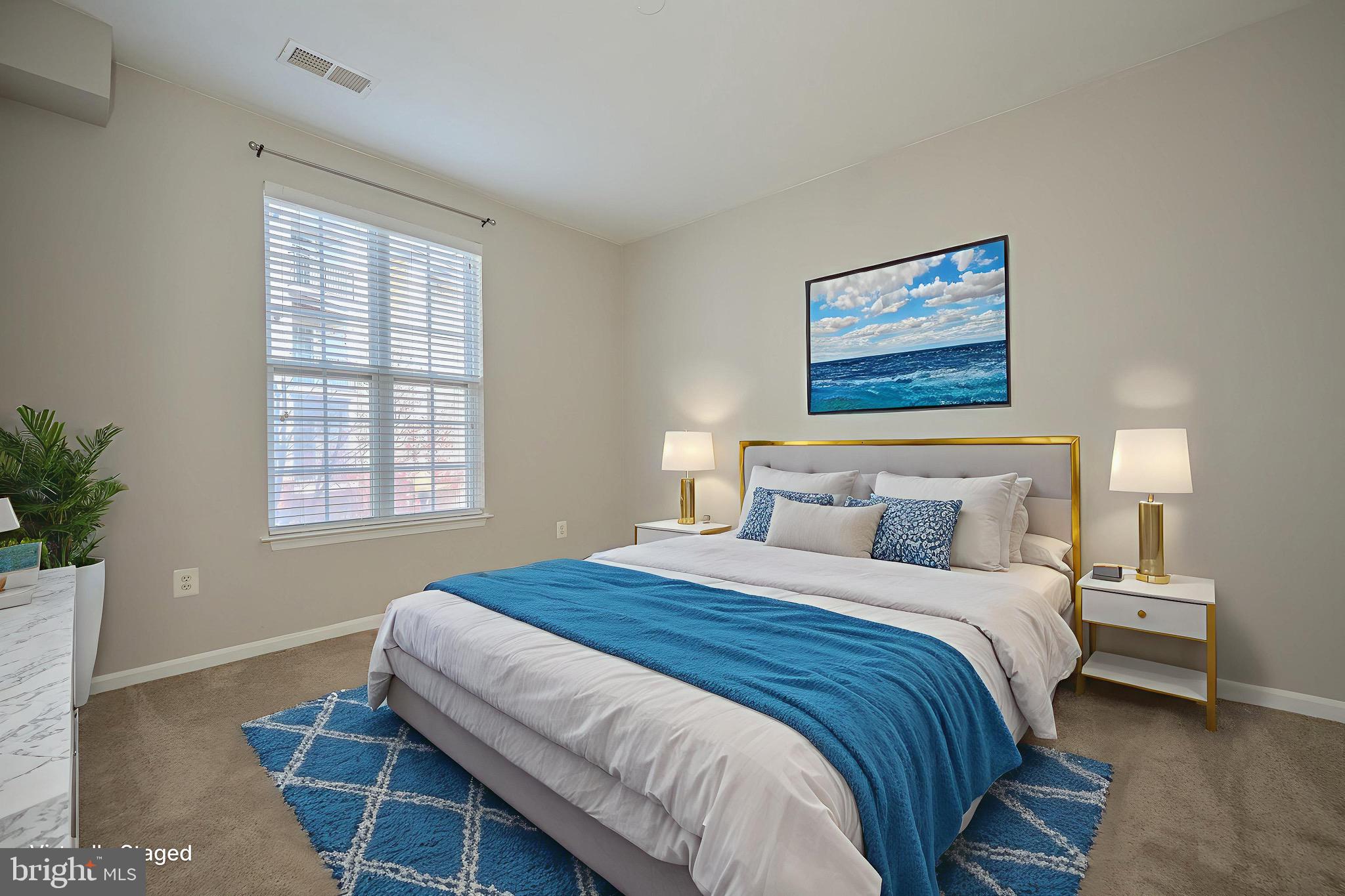 21216 McFadden Square, Unit 206 Sterling, VA 20165 - Photo 5 of 11 a bedroom with bed and window