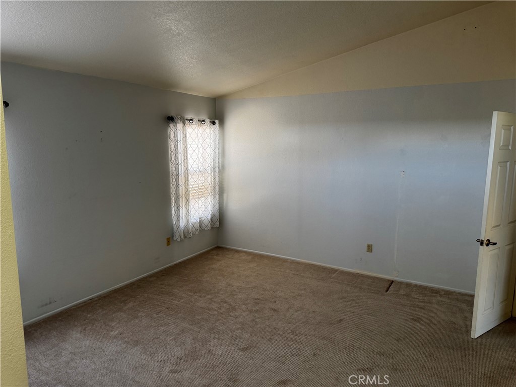 27519 Terrytown Road Menifee, CA 92586 - Photo 21 of 22 an empty room with windows and closet