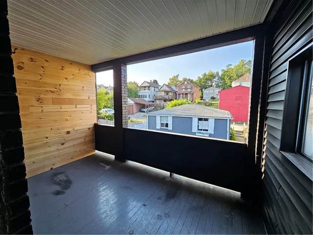 a view of a balcony with an outdoor space