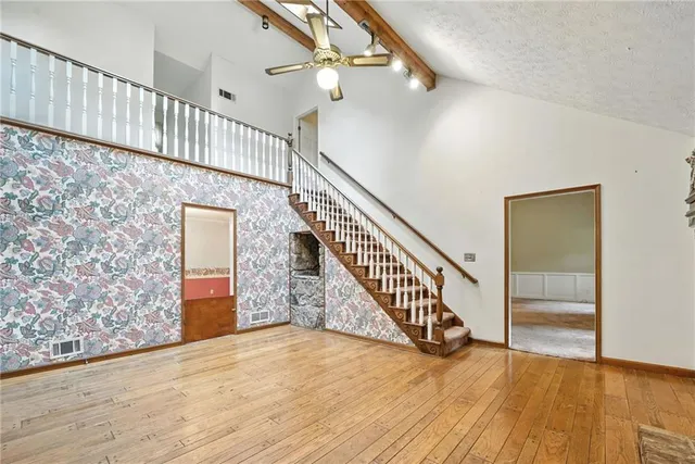 a view of an entryway with wooden floor
