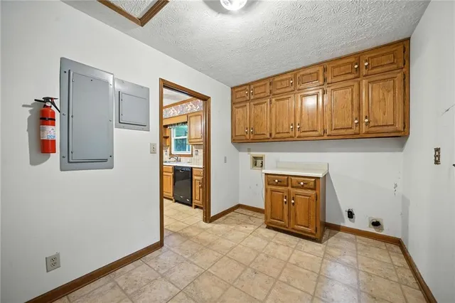 a view of a kitchen with electric appliances