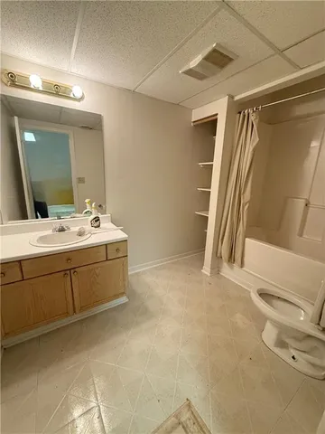 a bathroom with a double vanity sink and mirror