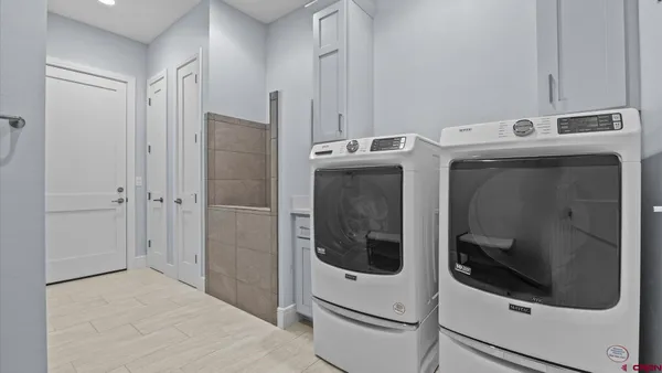 a utility room with dryer and washer