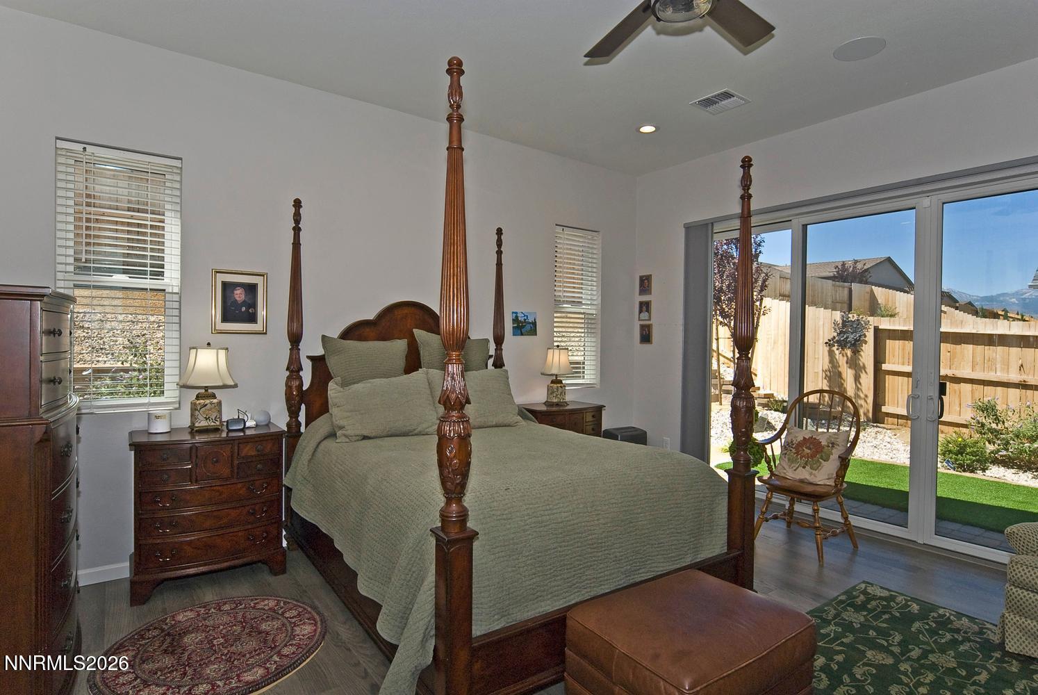 2332 Hammer Falls Drive Reno, NV 89521 - Photo 22 of 57 a bed room with furniture and a floor to ceiling window