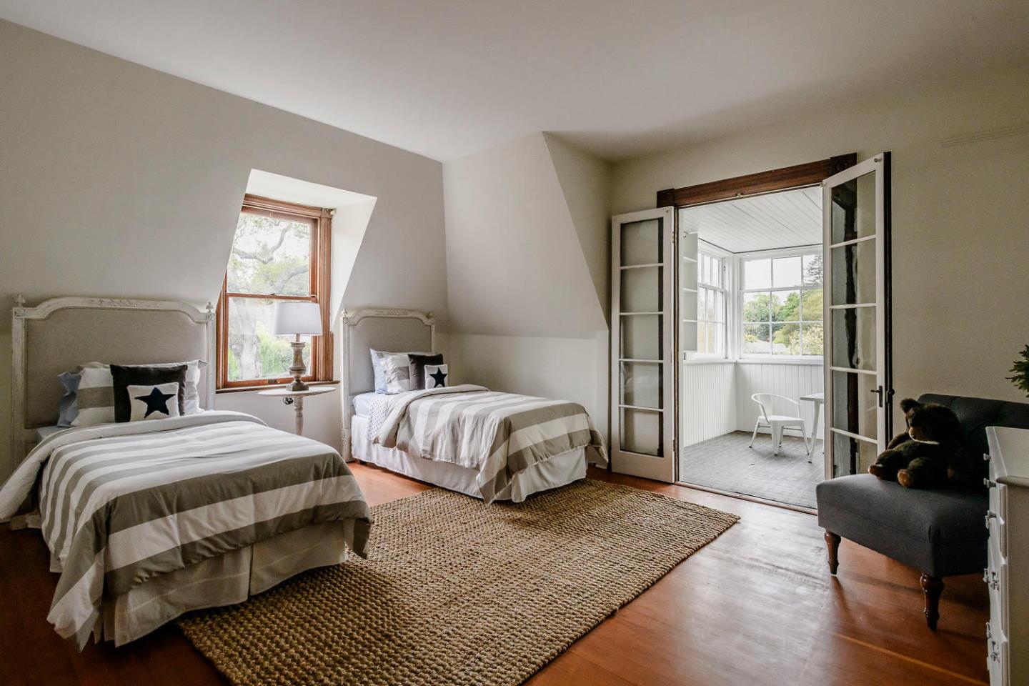 1136 Waverley Street Palo Alto, CA 94301 - Photo 19 of 28 a spacious bedroom with a bed and wooden floor