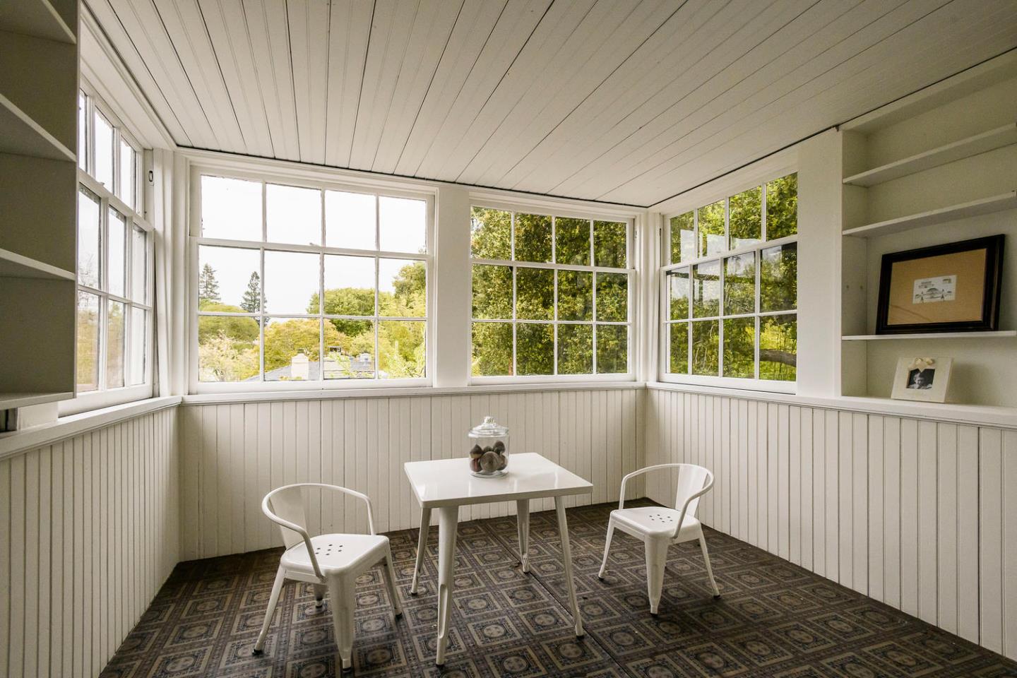 1136 Waverley Street Palo Alto, CA 94301 - Photo 20 of 28 a view of a dining room with furniture a rug and wooden floor