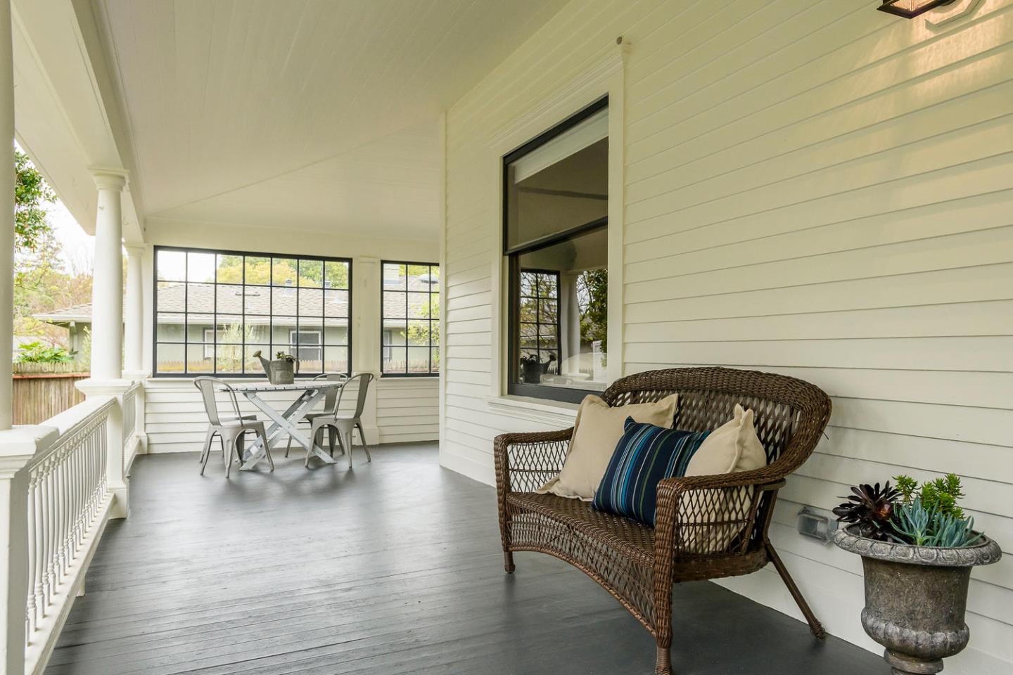 1136 Waverley Street Palo Alto, CA 94301 - Photo 2 of 28 a living room with furniture and floor to ceiling window