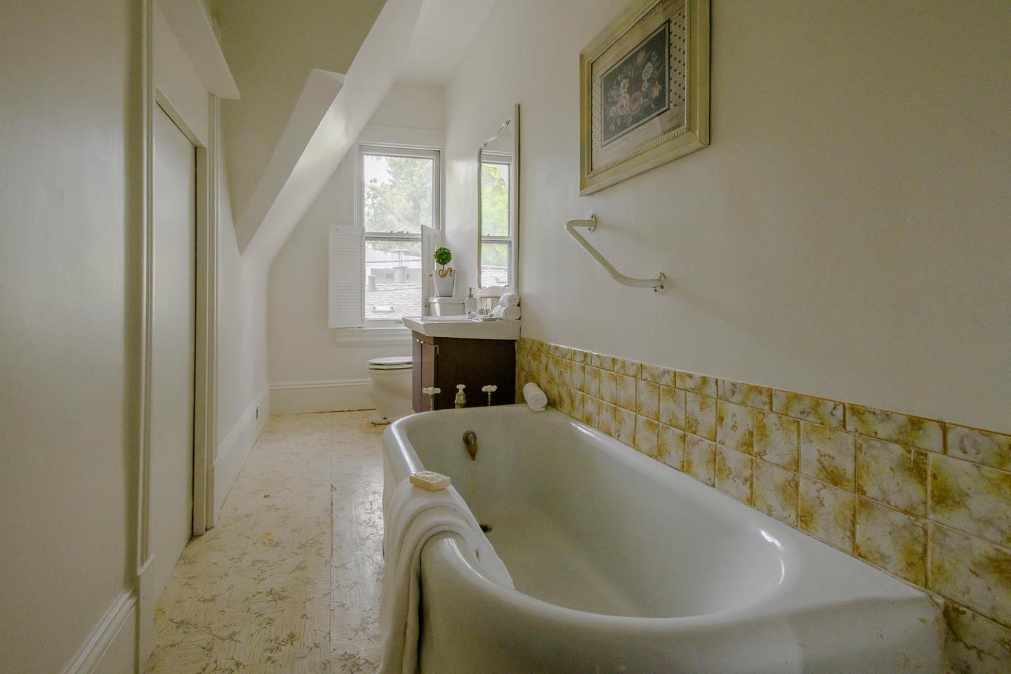 1136 Waverley Street Palo Alto, CA 94301 - Photo 22 of 28 a bath tub sitting in a bathroom next to a window