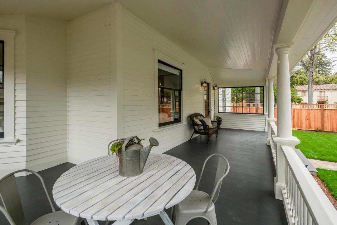 1136 Waverley Street Palo Alto, CA 94301 - Photo 3 of 28 a view of a dining room with furniture wooden floor and a potted plant