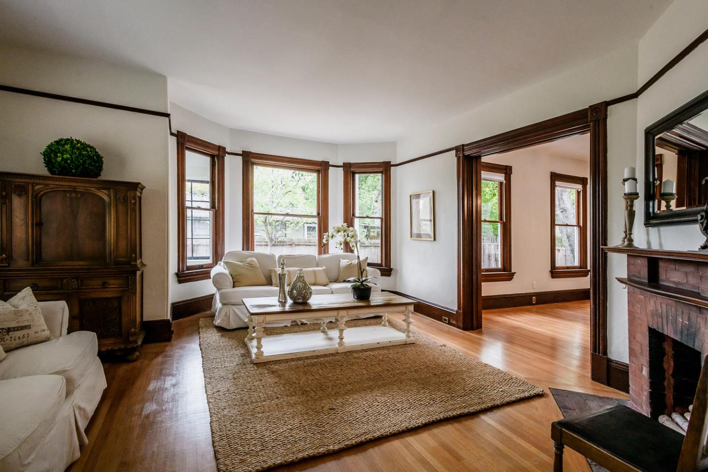 1136 Waverley Street Palo Alto, CA 94301 - Photo 6 of 28 a living room with fireplace furniture and a flat screen tv