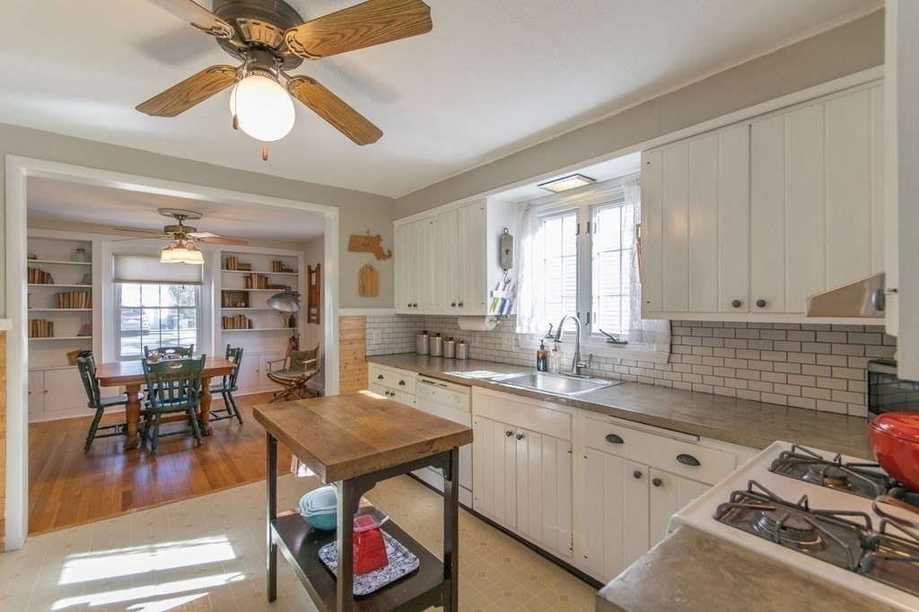 114 Appleton Street Springfield, MA 01108 - Photo 13 of 35 a kitchen with a table chairs stove and cabinets
