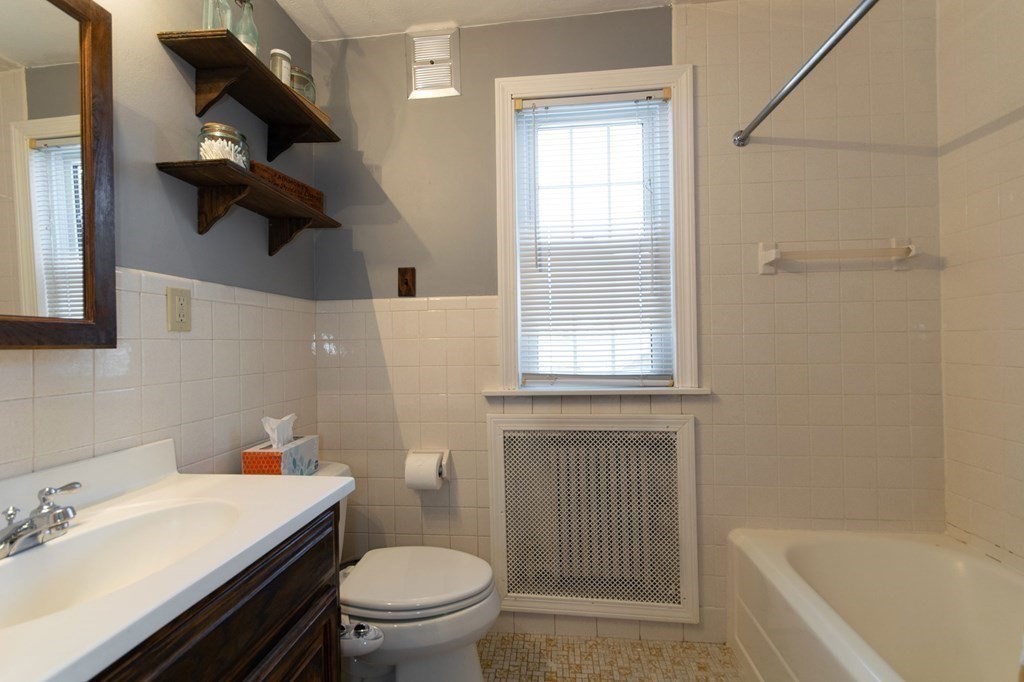 114 Appleton Street Springfield, MA 01108 - Photo 25 of 35 a bathroom with a sink a toilet and shower
