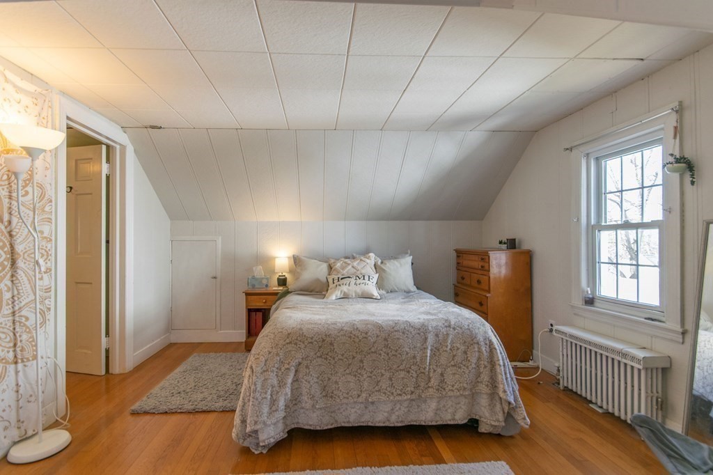 114 Appleton Street Springfield, MA 01108 - Photo 27 of 35 a bedroom with a bed and wooden floor