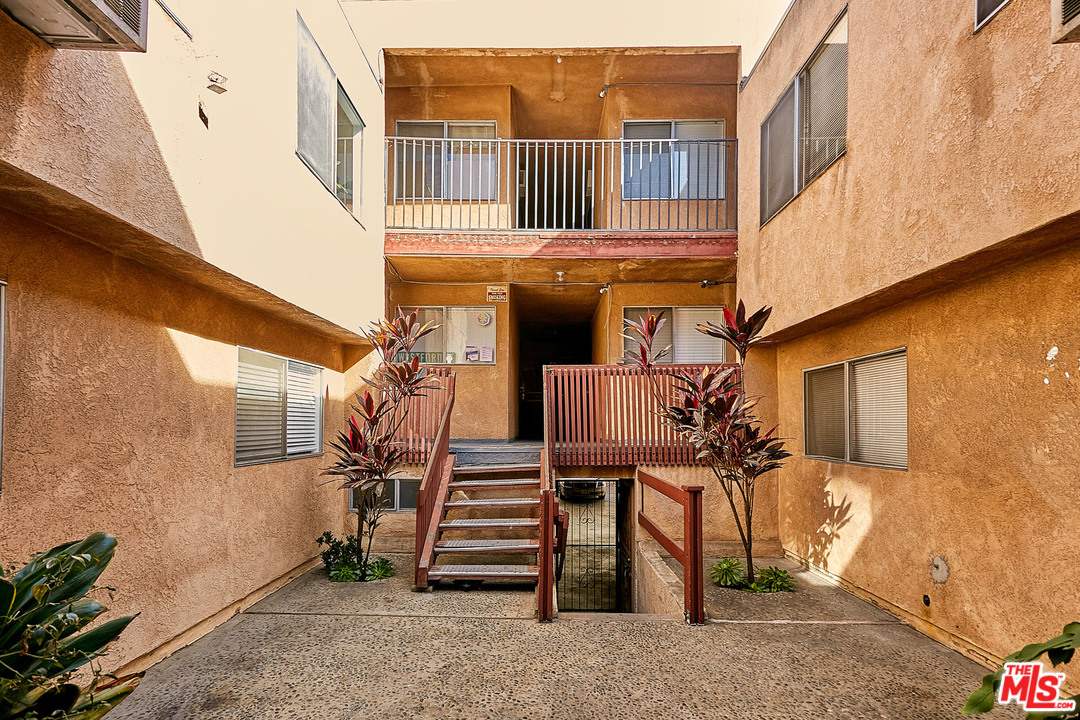 433 Cottage Home Street, Unit 4 Los Angeles, CA 90012 - Photo 12 of 13 a view of a house with a door