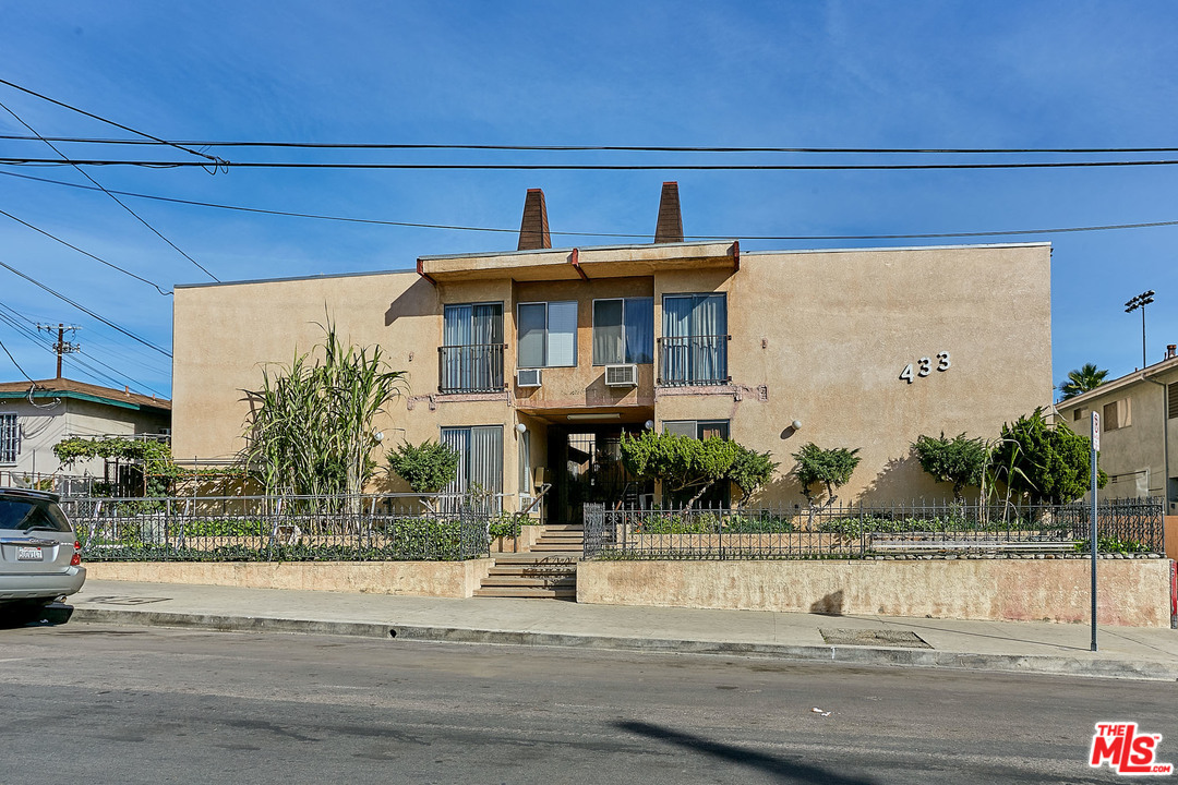 433 Cottage Home Street, Unit 4 Los Angeles, CA 90012 - Photo 13 of 13 a view of a brick house with a small yard