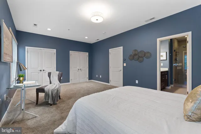 a bathroom with a granite countertop sink mirror and double