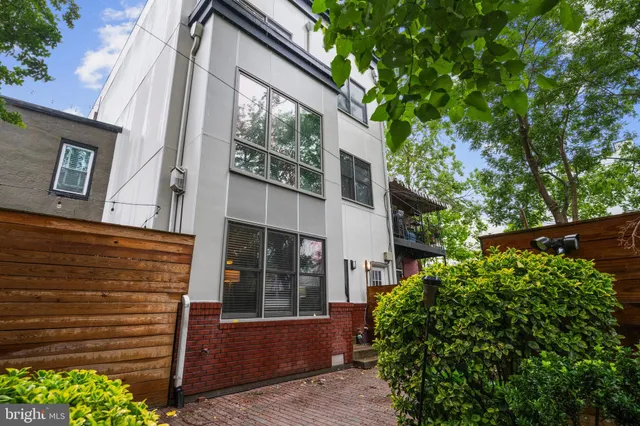 a view of a house with a tree