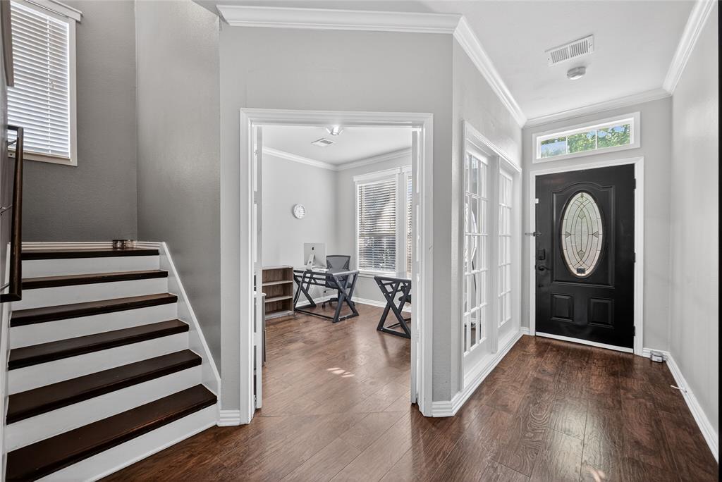 9633 Anns Way Plano, TX 75025 - Photo 5 of 37 a view of a room with wooden floor and white walls