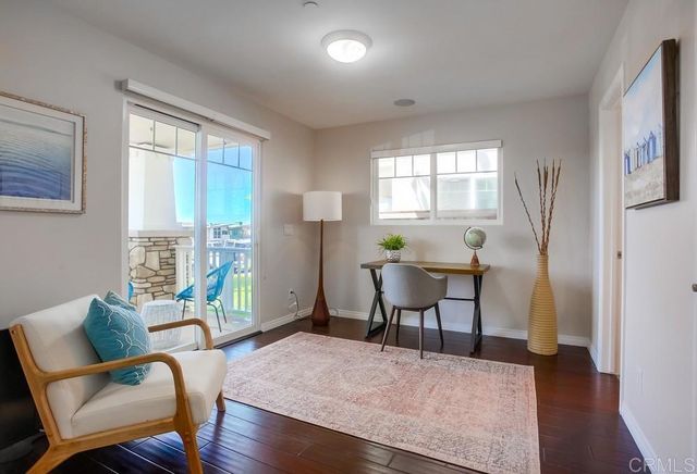 a workspace with furniture and a window