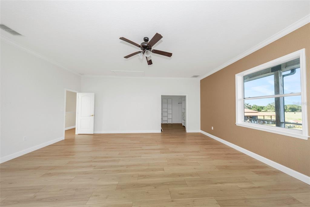 20138 Bowman Road Spring Hill, FL 34610 - Photo 36 of 40 a view of empty room with wooden floor and window