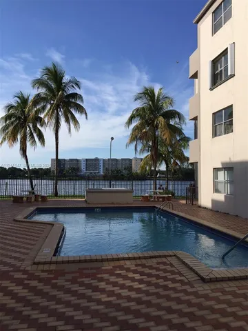 a view of a swimming pool with a chair