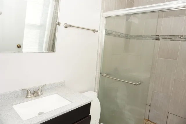 a bathroom with a sink a toilet and bathtub