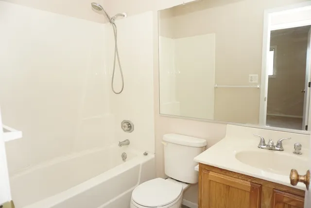 a bathroom with a toilet and a bathtub