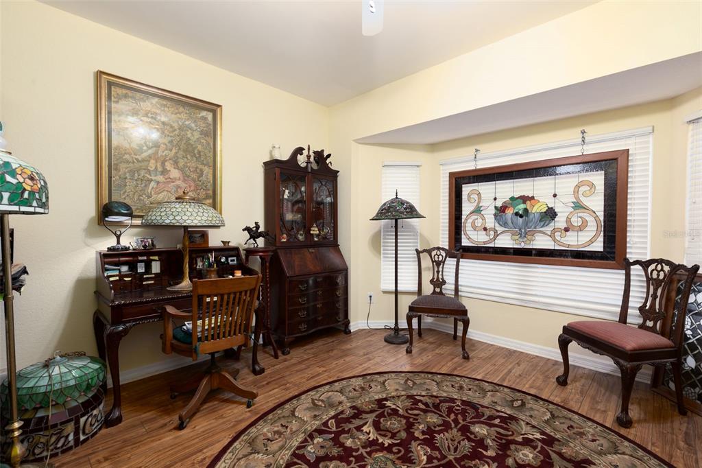 9341 Blind Pass Road St. Pete Beach, FL 33706 - Photo 12 of 44 a living room with furniture a rug and a large window