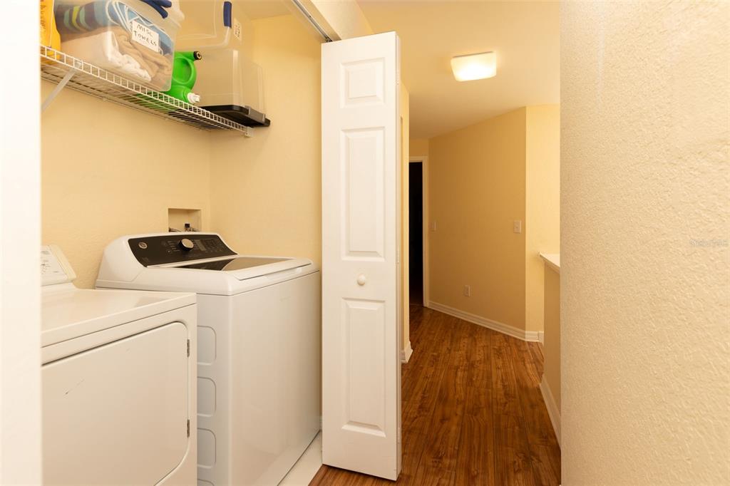 9341 Blind Pass Road St. Pete Beach, FL 33706 - Photo 17 of 44 a close view of a utility room with dryer and washer