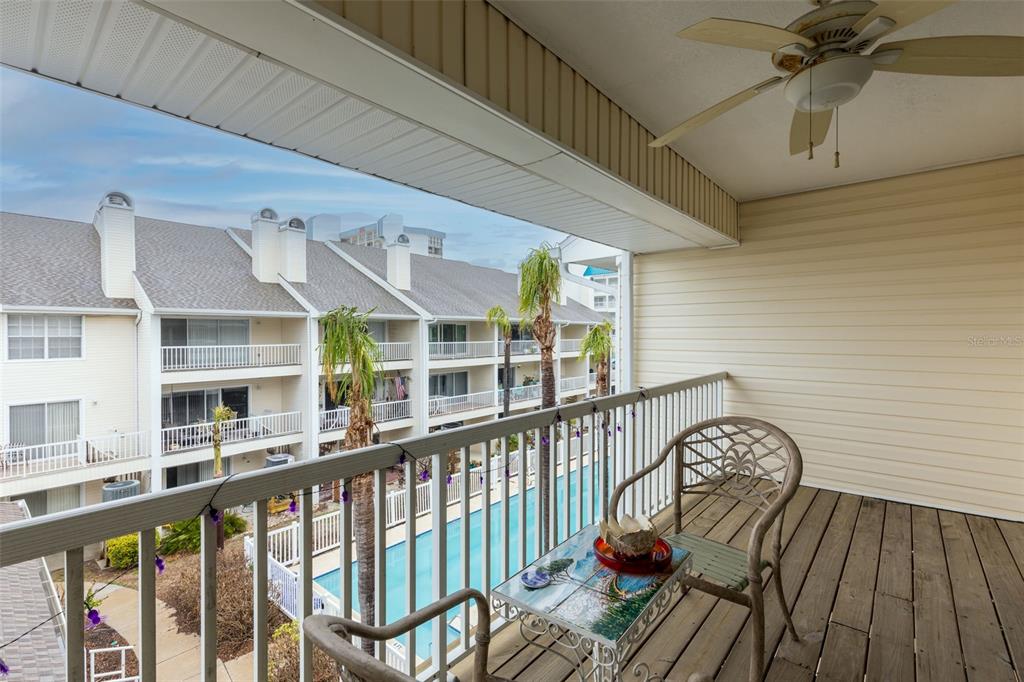 9341 Blind Pass Road St. Pete Beach, FL 33706 - Photo 23 of 44 a view of a balcony with furniture