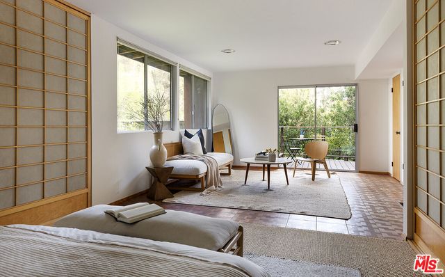 a view of balcony with wooden floor and fence