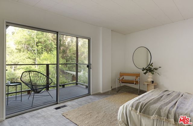 a view of outdoor space with wooden floor