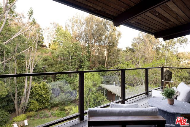 a view of a balcony with chairs