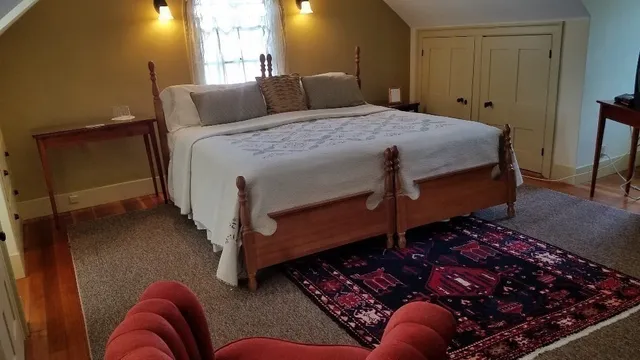 a bedroom with bed window and couch