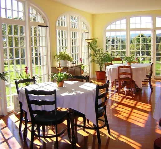 a view of a dining room with furniture large windows and wooden floor