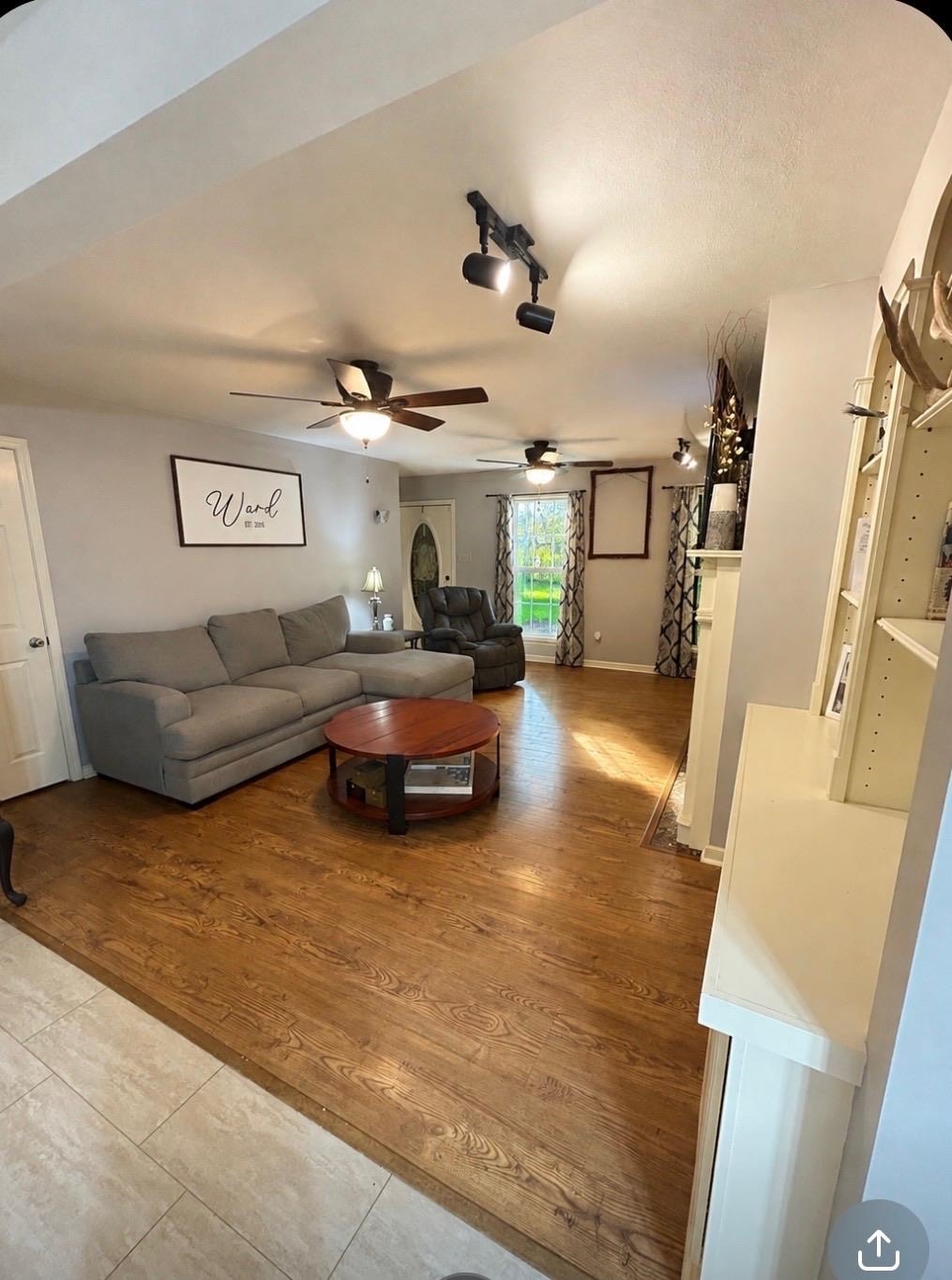 20 Pennington Road Halls, TN 38040 - Photo 9 of 27 Wood-finish flooring throughout, complemented by ceiling fans with integrated lighting