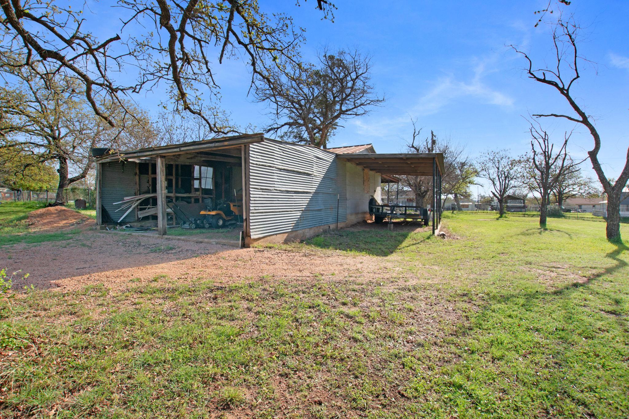 1365 Norma Tow, TX 78672 - Photo 41 of 45 a view of a house with a yard and garage
