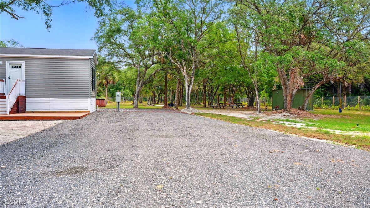 545 South Estribo Street Clewiston, FL 33440 - Photo 5 of 13 a view of a park with swings and slides